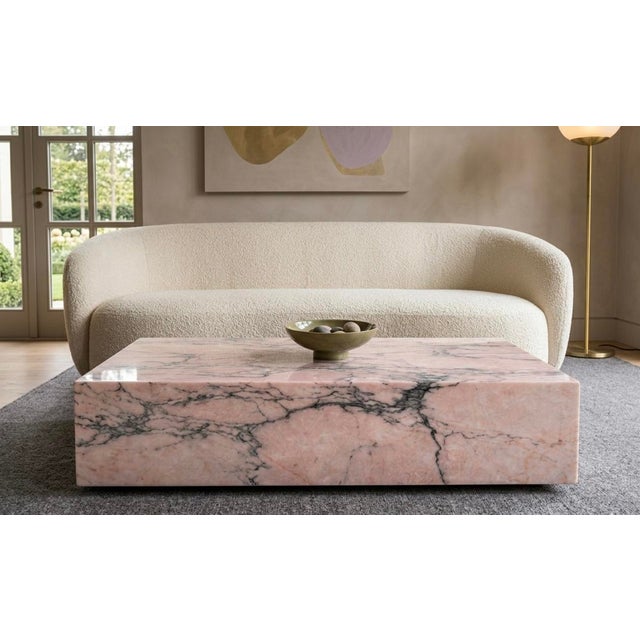 This table in Rosa Portogallo marble is a piece of furniture that embodies the timeless elegance and craftsmanship of Made...
