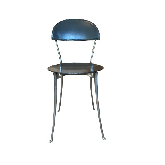 A set of four Tonietta dining chairs designed by Enzo Mari for Zanotta, Italy purchased in 1990. Originally introduced in...
