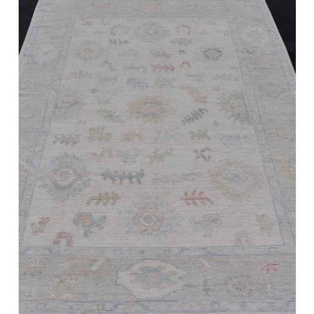 Tribal Large Oushak Rug With Floral Motifs & Muted Colorful Tones on Neutral Background For Sale - Image 3 of 12