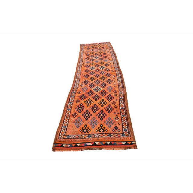 Decorative handknotted vintage runner rug from Northern Iraq. Approximately 50-60 years old. In very good condition.