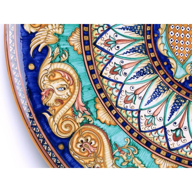 Copper Green Dragons Plate by deBlona Dimensions: D 60 x H 1 cm. Materials: Ceramic. Colors: Copper green, Deruta blue,...