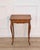 Charming Louis XV–style miniature side table crafted in fruitwood during the early 20th century. The piece reflects the...