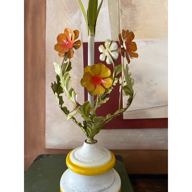 A joyful, sculptural tole lamp with unmistakable European charm. This hand-painted metal table lamp features layered...