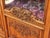 Richly carved bookcase made of solid oak with partially glazed doors and transoms decorated with carvings. The interior of...