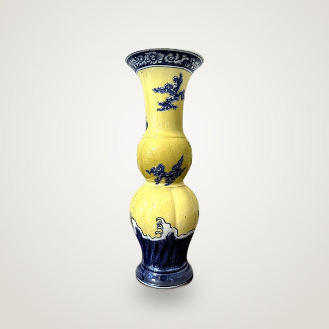 A striking Wedgwood vase in the Chinoiserie style, its double-gourd body finished in a rich yellow ground and hand-...