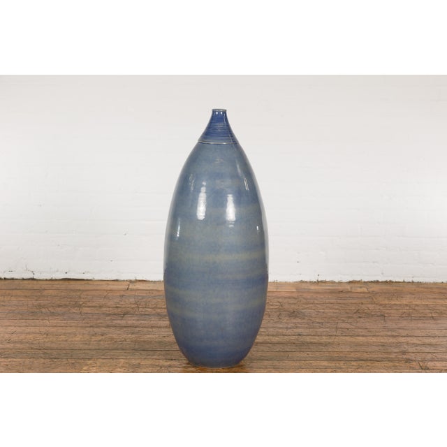 A tall Prem Collection ceramic artisan hand crafted vase with rounded lines. Experience the beauty of authentic, handmade...