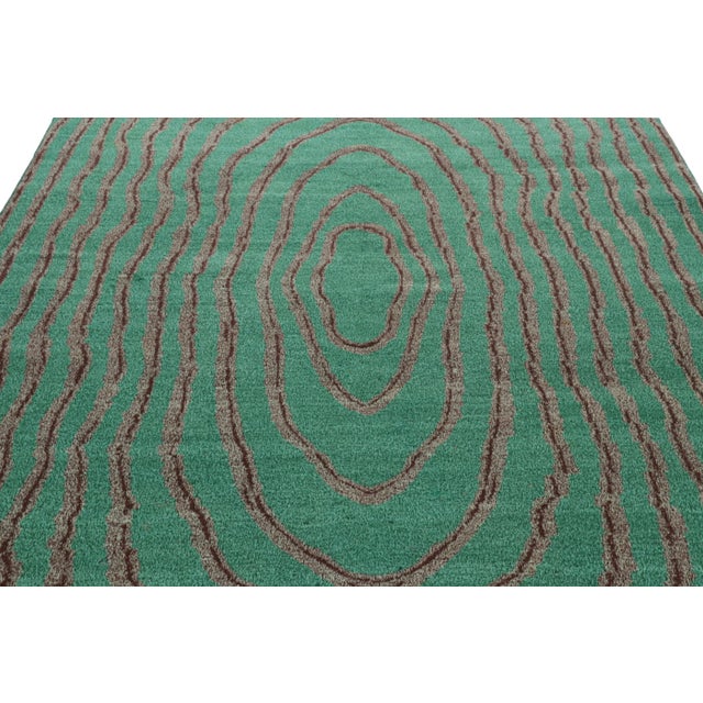 Made with hand-knotted wool circa 1960-1970, this 7x10 vintage rug from Turkey is believed to be the work of mid-century...