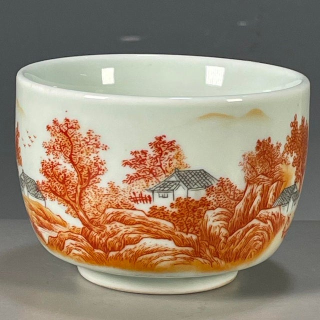This is a charming vintage porcelain teacup, decorated in a combination of blue and white (青花) and underglaze red enamels....