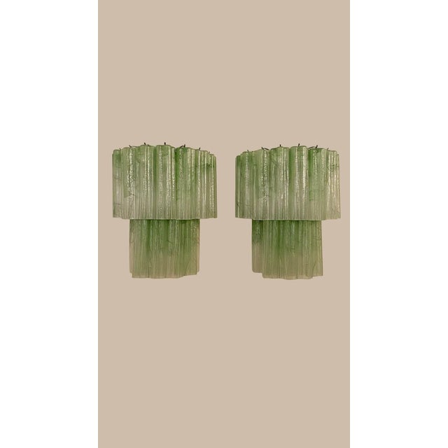 DUTIES FREE A spectacular pair of Italian Murano glass wall sconces featuring thirteen handcrafted green alabaster glass...