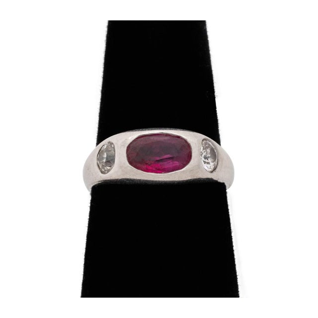 Platinum Ruby and Old Mine Diamond Gypsy Set Three-Stone Ring, marked: "P Pt." Ring size 6 1/2 US. 7/8" x 3/4" approx.; 1...