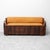 Wooden chest with padded seat and backrest upholstered in leather. Featuring contoured armrests. Large storage...