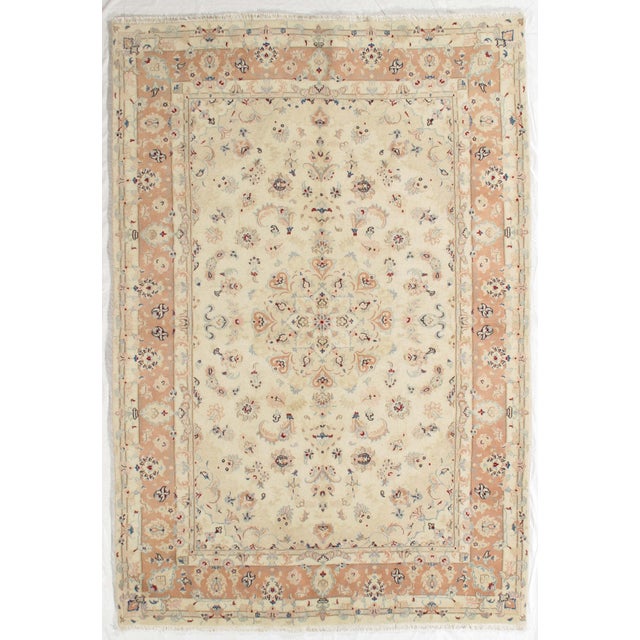 Vintage Hand-knotted Persian Tabriz rug from northwest Iran, known for its fine weave and detailed floral patterns....