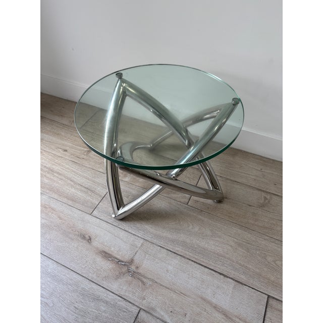 Small sculpture chrome and custom glass fits top to perfection . I think it makes the geometric chrome base look very chic