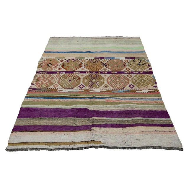 Decorative vintage handwoven kilim rug from Marash region of Turkey. Approximately 50-60 years old. In very good condition.