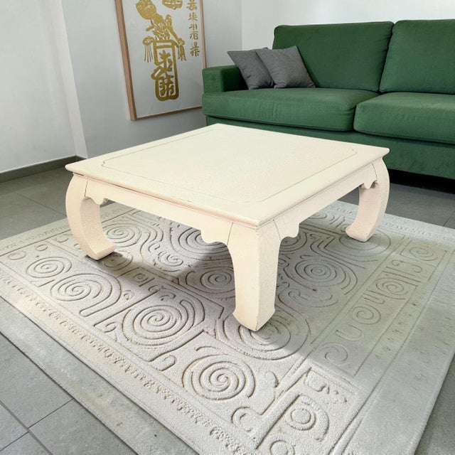 A Ming-style square coffee table by Lane Furniture, produced circa 1990 and executed in a cream crackle lacquer finish....