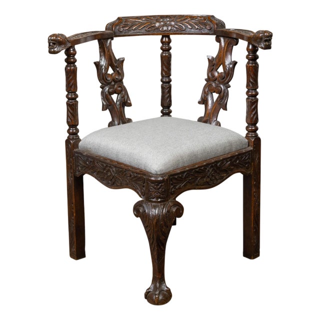 English 19th Century Oak Corner Chair with Carved Foliage and New Upholstery For Sale