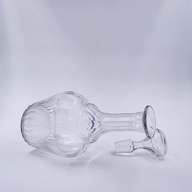 Glass Carafe Wear consistent with age and use.Measures : Ø 14cm H:35cm Material : Cristal