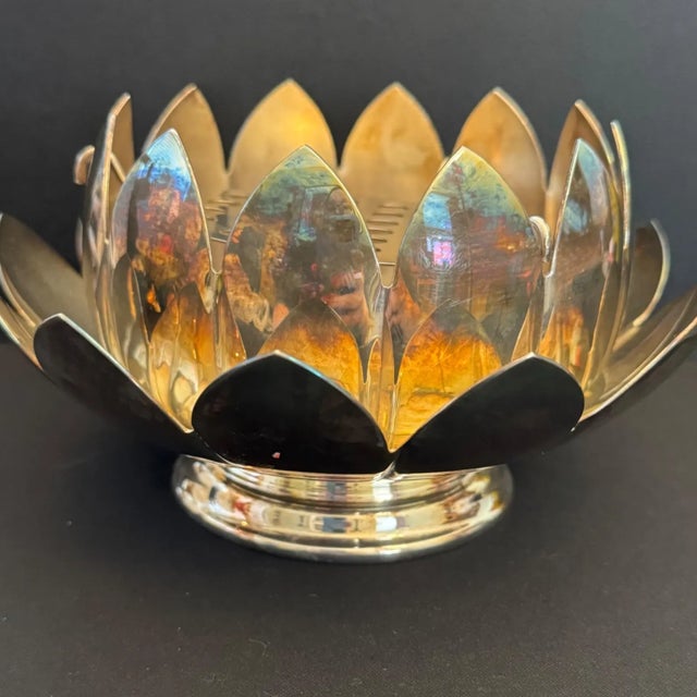 A striking mid-century modern silver-plated modular centerpiece bowl produced by legendary American silversmith Reed &...