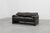 A beautifully proportioned two‑seat sofa designed by Vico Magistretti and produced by Cassina in 1990, reflecting the...