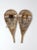 A pair of vintage American wooden trail snowshoes featuring gracefully shaped wood frames, traditional woven webbing, and...