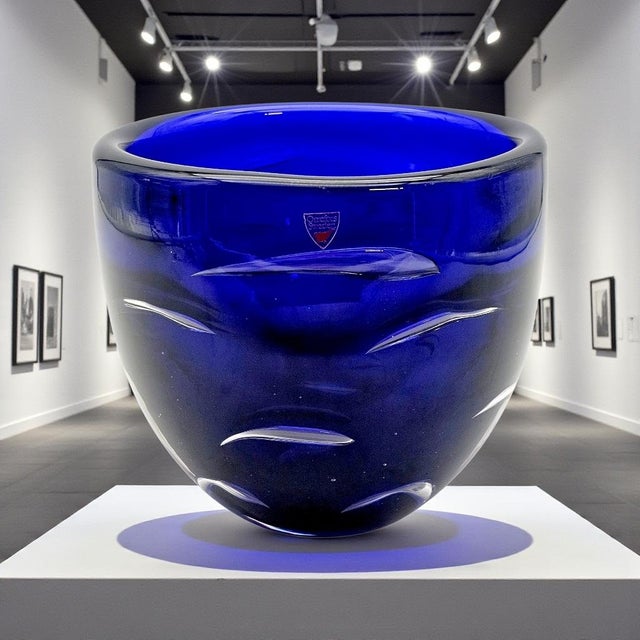 A substantial example of Swedish art glass produced by Orrefors under the design direction of Lars Hellsten. Executed in...