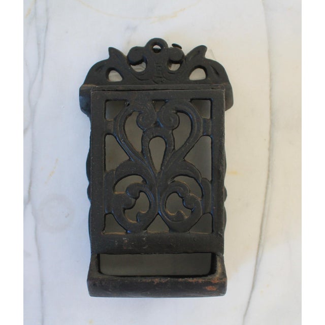 Vintage black cast iron wall mounted match stick holder. Made in Taiwan. Some oxidation. Includes 2 screws.