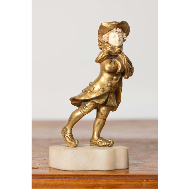 This charming early 20th-century French sculpture combines the elegance of gilt bronze and the lifelike detail of ivory to...