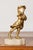 This charming early 20th-century French sculpture combines the elegance of gilt bronze and the lifelike detail of ivory to...