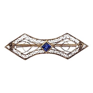 14 Karat Yellow Gold With Sapphire Center Stone Filigree Brooch For Sale