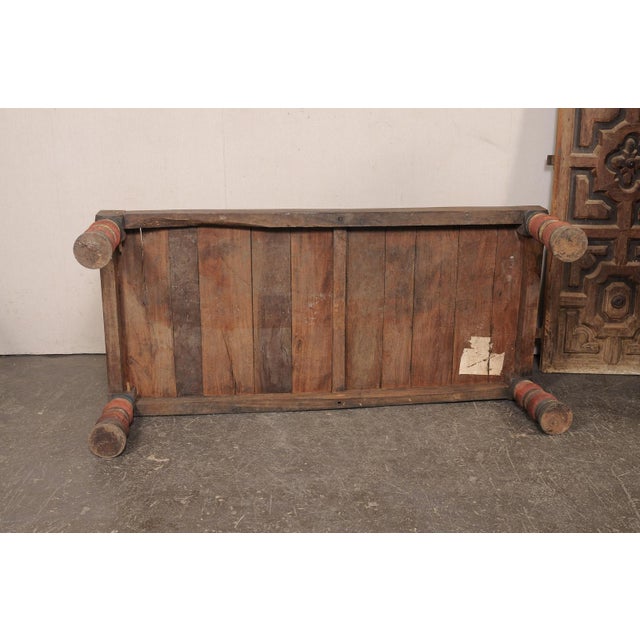 A British Colonial daybed (or coffee table) from the early 20th century. This antique British Colonial daybed from Kerala,...
