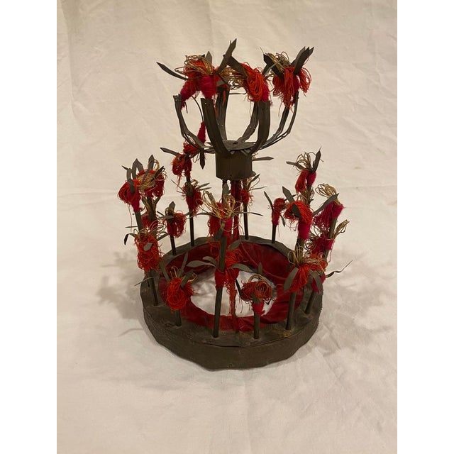 Likely a Thai ornamental crown sitting atop a carved round Chinese tray on a pedestal. Great combination of two pieces for...