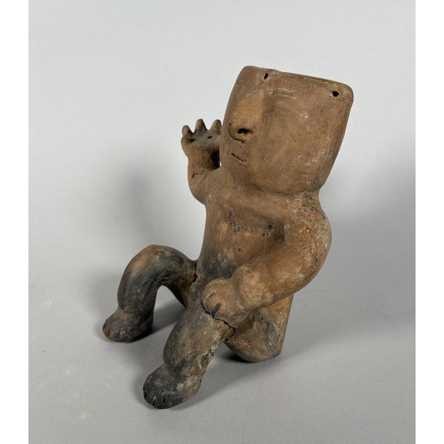 Quimbaya culture, Colombia, Central Cauca Valley. Circa 500-1500 AD. Terracotta figurine of a seated chieftain ("Cacique")...