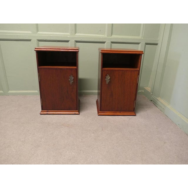 A Pair of Mid Century Bedside Cabinets This is a very useful pair, each one has an open storage shelf over a shelved...