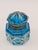 An elegant and exceptionally decorative antique inkwell made of faceted, deep blue glass, most likely from France, dating...