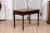 An Italian walnut side table from circa 1890 with elm star marquetry, single drawer and turned legs. This Italian walnut...