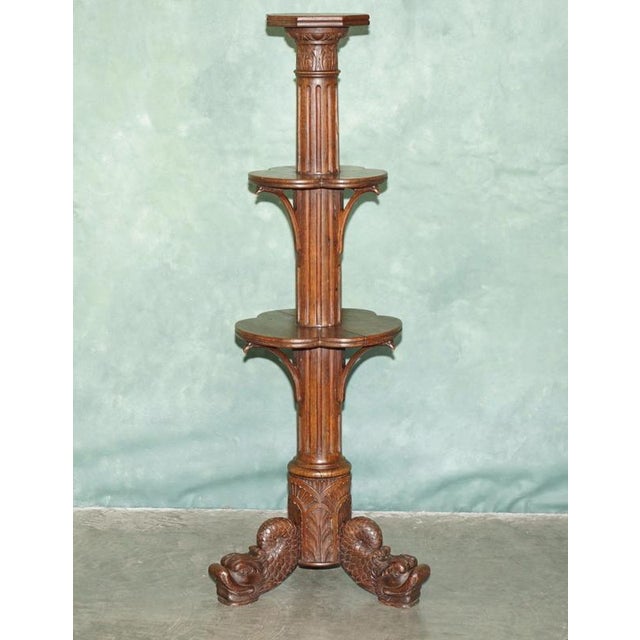 Fine Regency Carved Mahogany Three-Tier Dumb Waiter with Dolphin Supports, Circa 1820 A particularly striking Regency...