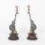 Sophisticated Mid-Century pair of elephant candleholders crafted with mixed metals. The candle cups are cast brass in a...