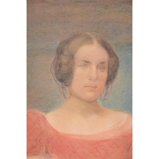 Woman in Red is a beautiful pastel and charcoal original drawing on paper glued on cardboard, realized by an unknown...