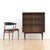 Designed by Dalescraft, this elegant mid-century display cabinet is crafted with clean architectural lines and tapered...