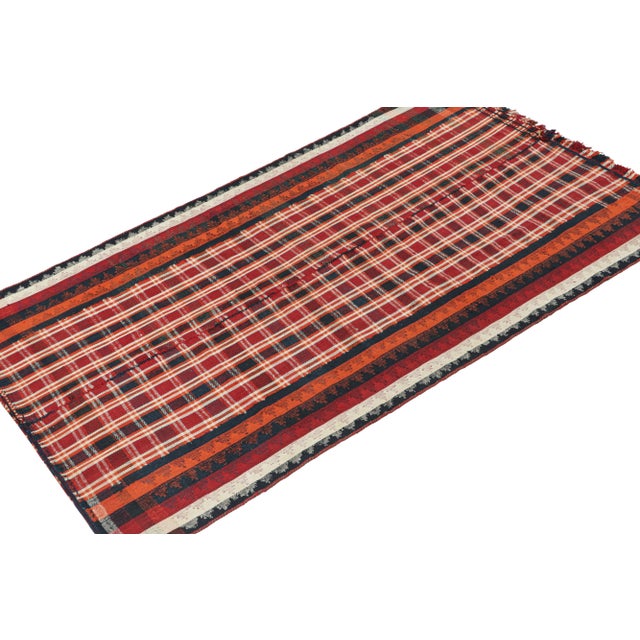 This vintage 5x8 Persian tribal kilim is handwoven in wool, and originates circa 1950-1960. This design remarks the panel-...