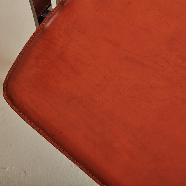 A pair of 1970s Italian side chairs reminiscent of avant-garde designs by Pierre Cardin. The sculptural, chrome frames...