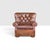 This classic vintage Churchill armchair beautifully embodies the timeless sophistication of classic English club...