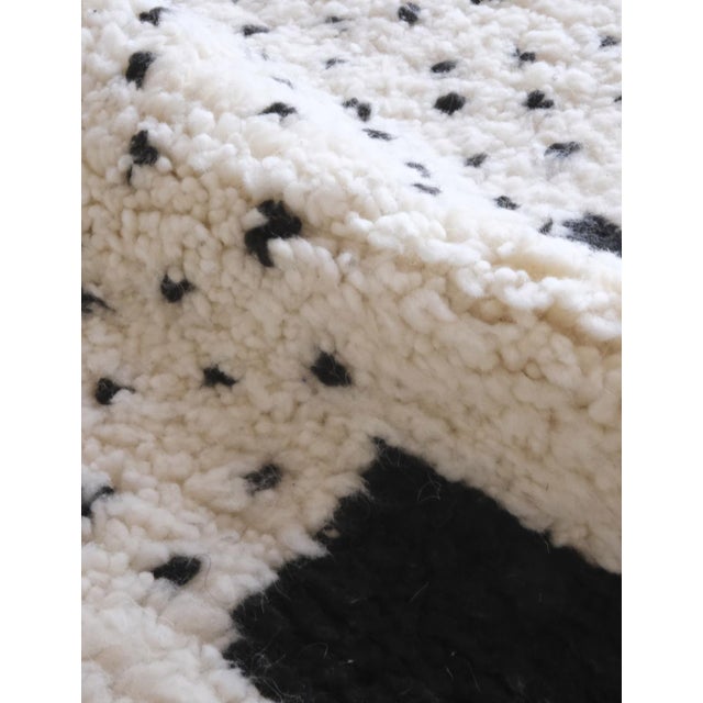 Elevate your space with our elegant Beni Ourain Moroccan Wool Rug. Made from organic materials, this luxurious piece adds...