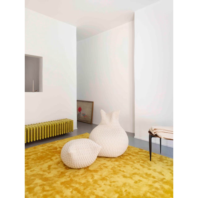 The pouffes are made in a three-dimensional elastic fabric and their shapes are highly flexible. They take the form of...