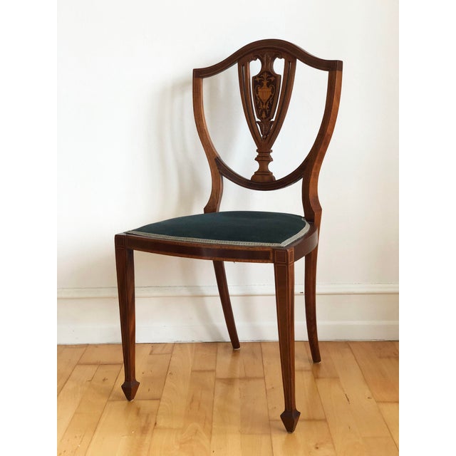A beautiful pair of antique Danish chairs made around 1900, inspired by the classic English Hepplewhite style. Each chair...