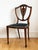 A beautiful pair of antique Danish chairs made around 1900, inspired by the classic English Hepplewhite style. Each chair...