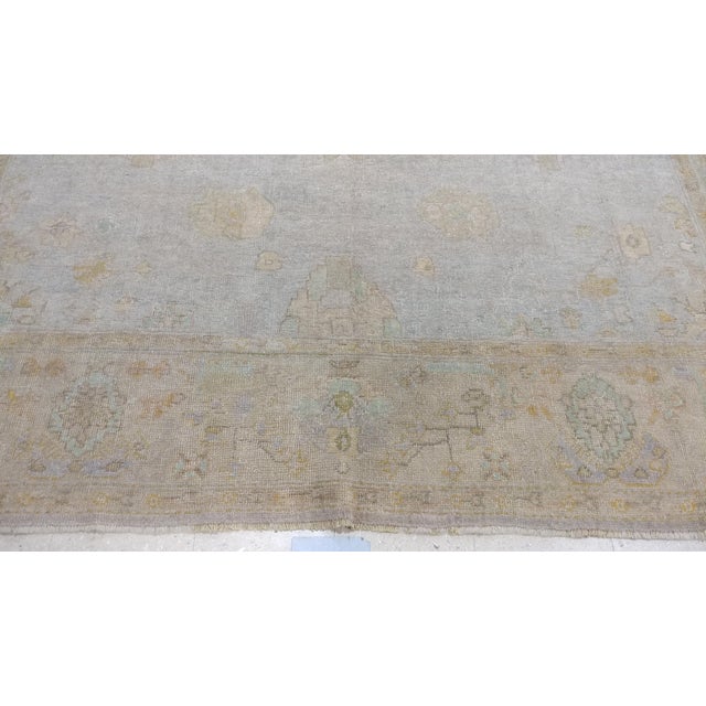 This exquisite late 19th-century Oushak carpet, crafted in West Anatolia around 1890, showcases the rich tradition and...