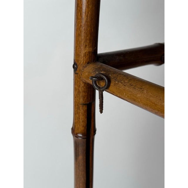 This stunning Art Nouveau side table made of bamboo is a real gem! It's a true rarity and a must-have for any collection....