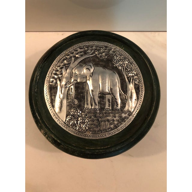 This fabulous Round Green Wood Box With Elephant Tin Accent will be a wonderful addition in your den, home office or...