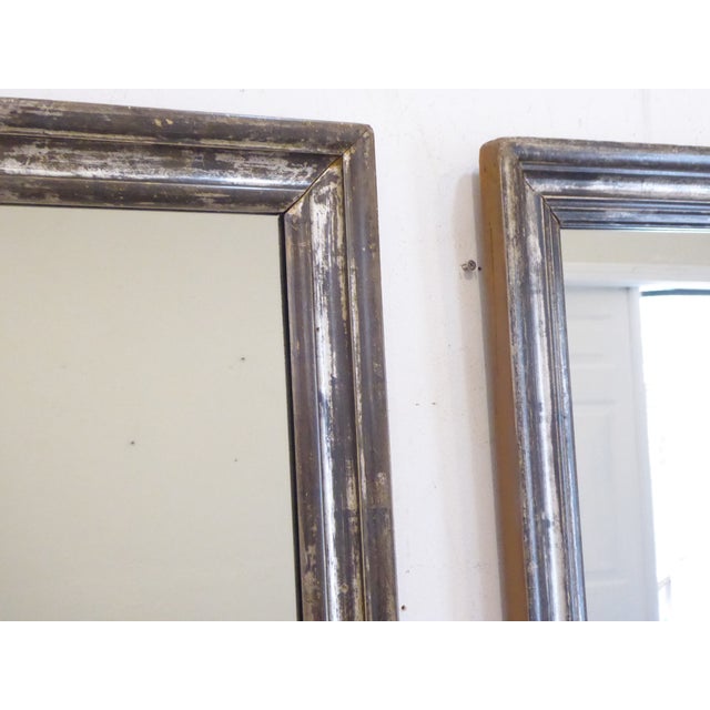 These weathered silverleaf mirrors are a near pair, the molding is not an exact match. They measure 28"H x 22"W
